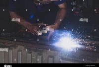 Welder, welding automotive part in a car factory 7001118 Stock Photo at ... Automotive Welding Shops Near Me