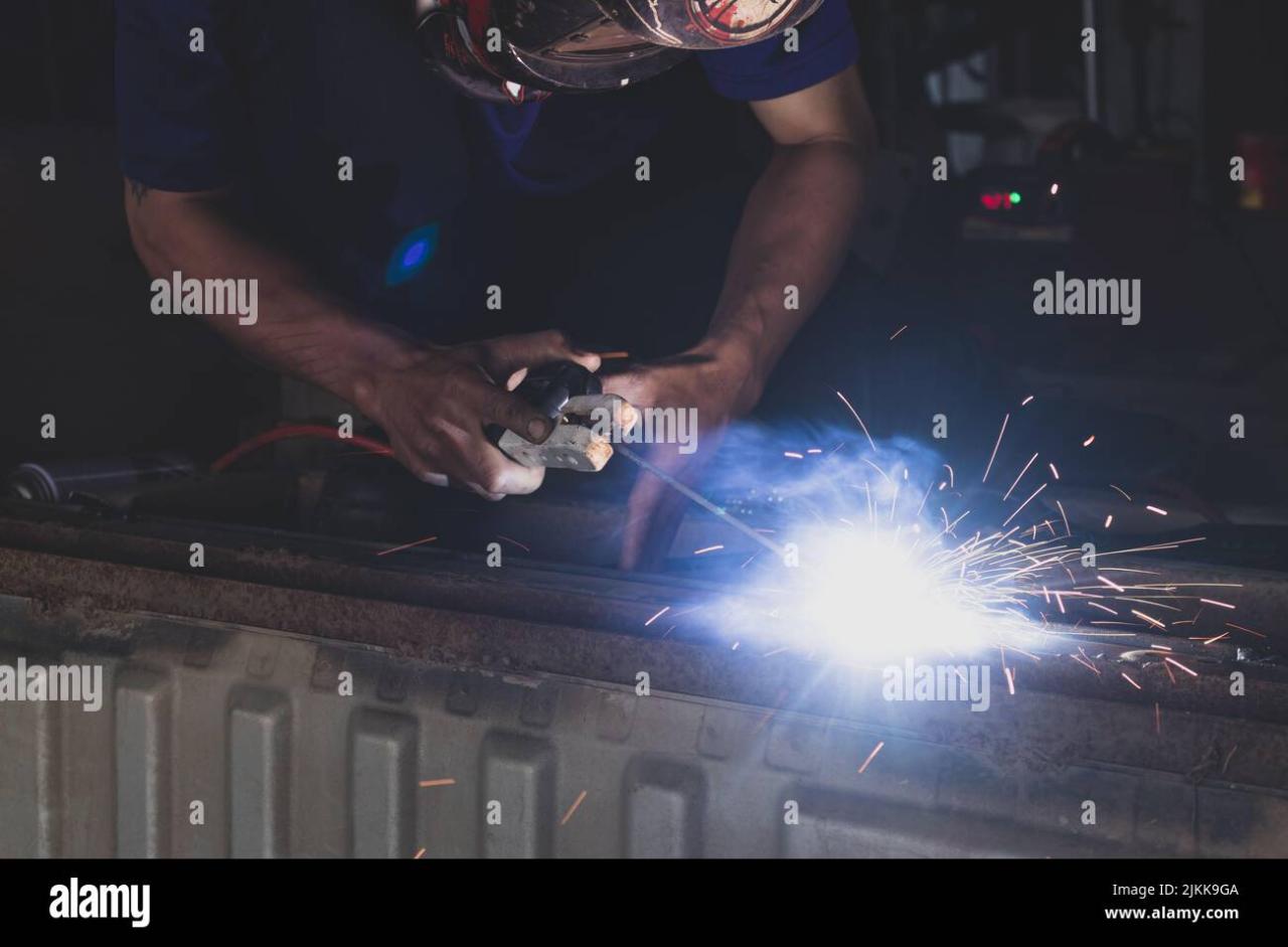 Welder, welding automotive part in a car factory 7001118 Stock Photo at ... Automotive Welding Shops Near Me